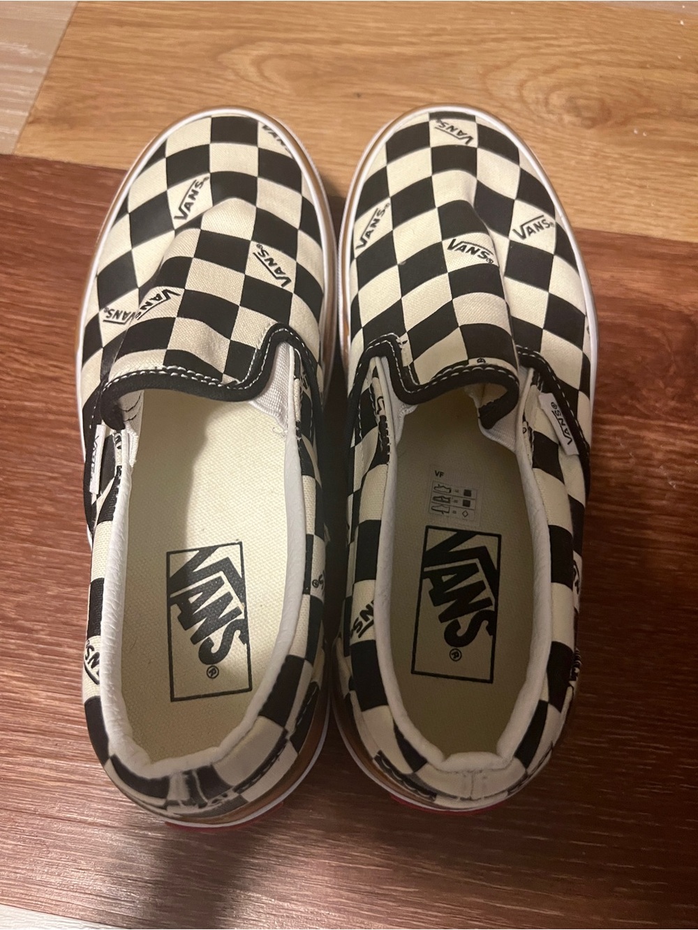 Vans Checkerboard Platform Slip-On Sneakers in Black and White